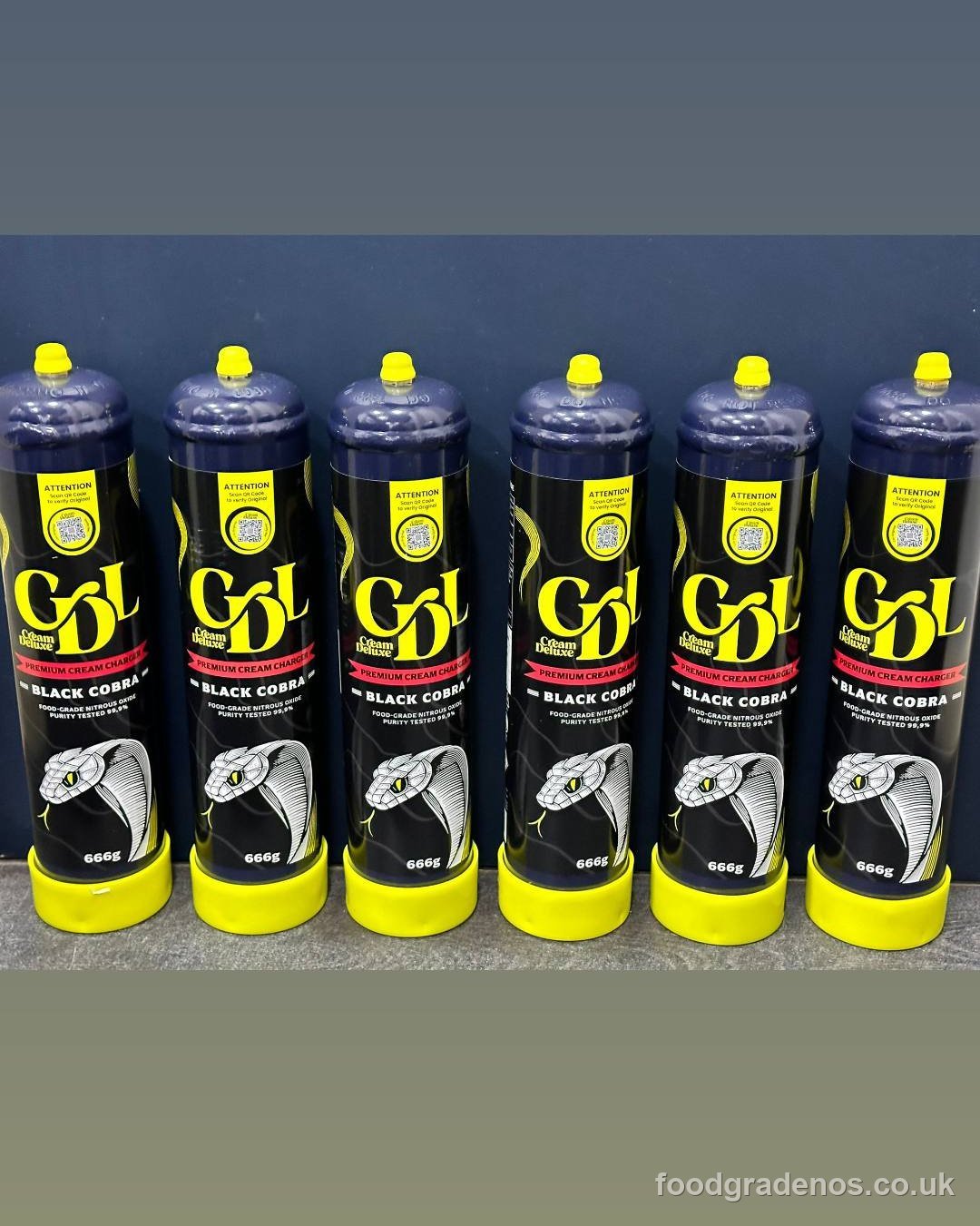 A row of Cream Deluxe Black Cobra 666g food-grade cylinders