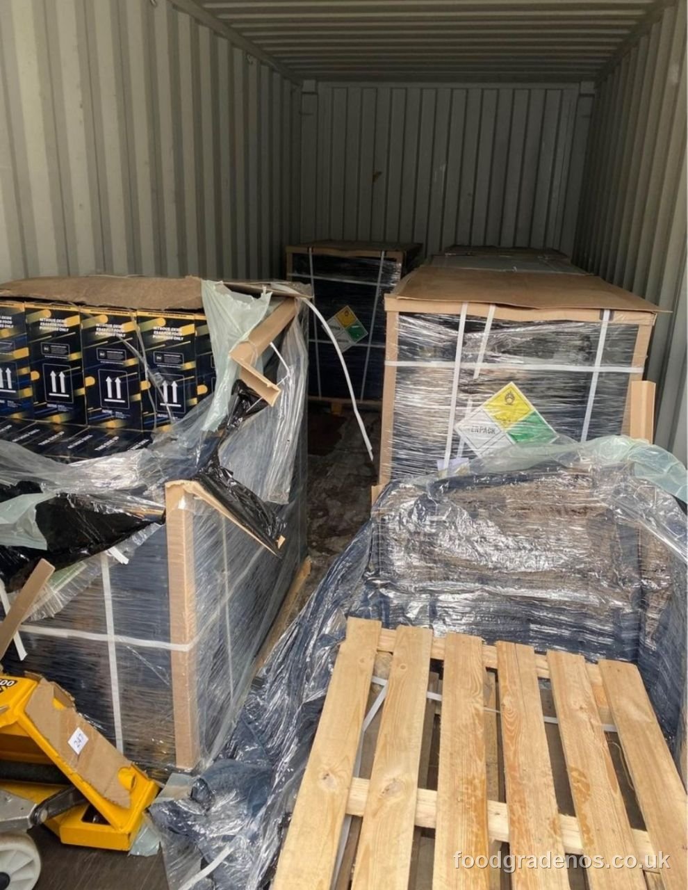 Palletised food-grade nitrous oxide stock inside a shipping container at the Food Grade NOS facility