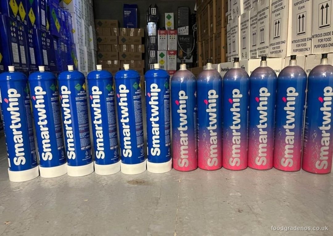 A row of Smartwhip food-grade nitrous oxide cylinders in the Food Grade NOS warehouse
