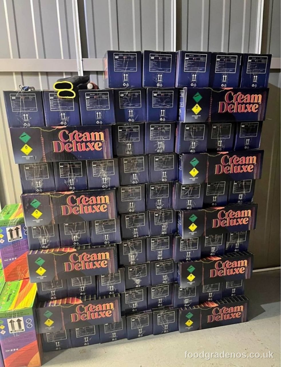 Cases of food-grade nitrous oxide cream chargers stacked in the warehouse